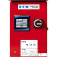 The Eaton 3-Phase Jockey Panel: XTJP-G06-L1 in red comes with a touchscreen display that clearly presents settings. Adjacent to the screen, there is a functional black and white toggle switch. The device's surface displays brand logos and compliance icons, highlighting its reliability and commitment to quality assurance.